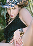 Aria Giovanni in pigtails pinches nipples and spreads pussy